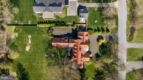 an aerial view of houses with yard