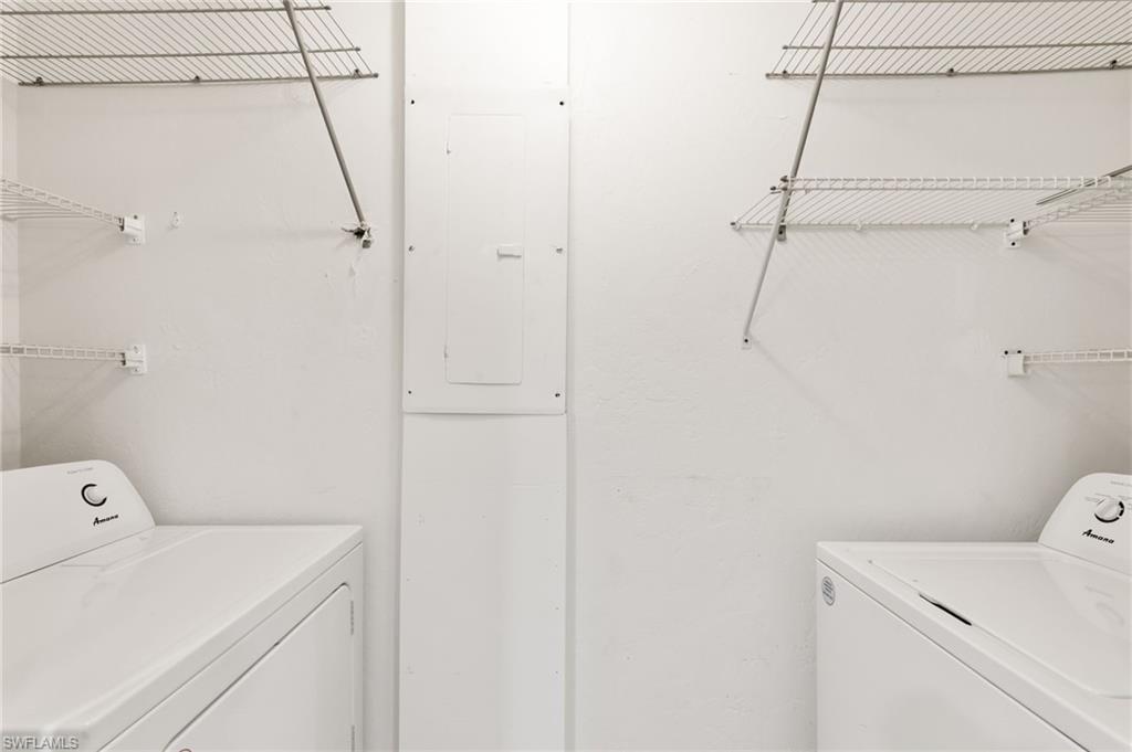 17017 Golfside Circle, Unit 404 Fort Myers, FL 33908 - Photo 17 of 22 a utility room with dryer and washer