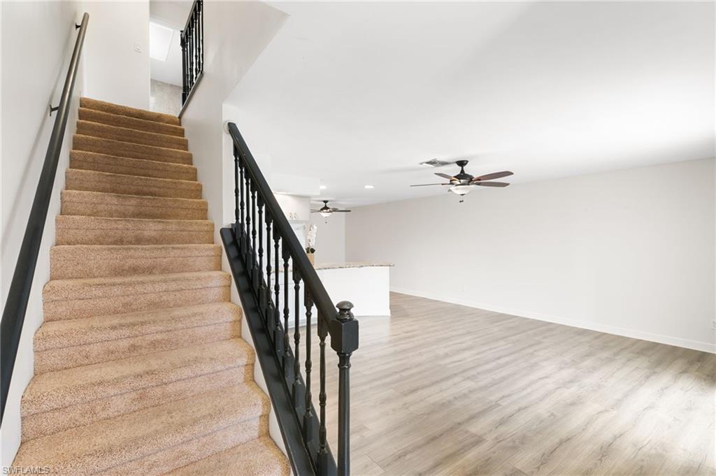 17017 Golfside Circle, Unit 404 Fort Myers, FL 33908 - Photo 4 of 22 an entryway in wooden floor hall witha front door