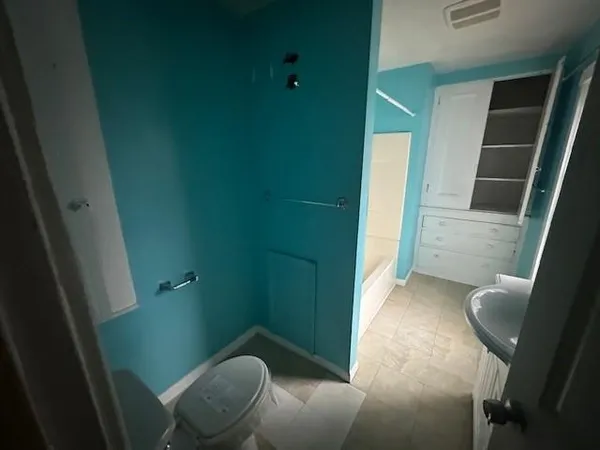 a bathroom with a sink and toilet