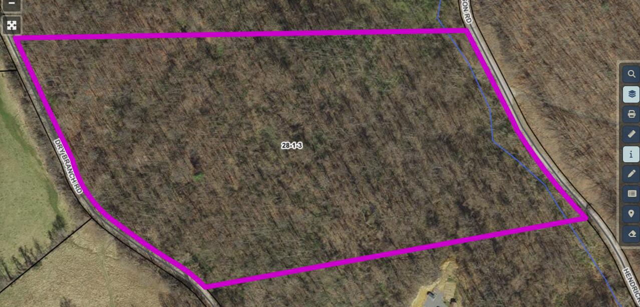 0 Dry Branch Road Pembroke, VA 24136 - Photo 2 of 29 a street sign sitting on a sidewalk in front of a building