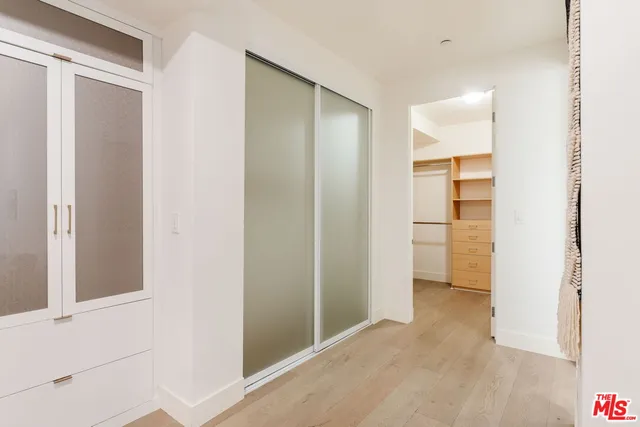 a bathroom with a tub shower vanity and a sink
