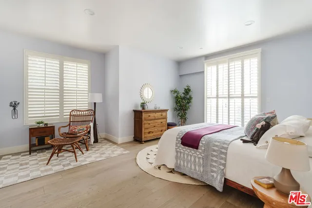 a view of a porch with furniture and a yard