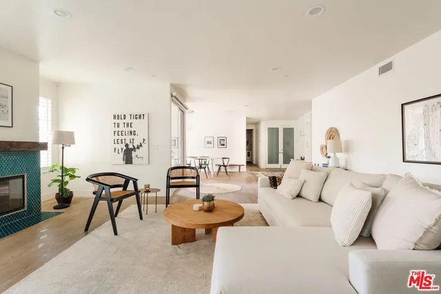 a bedroom with a bed and a rug