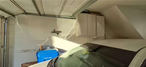a kitchen with appliances cabinets and a sink