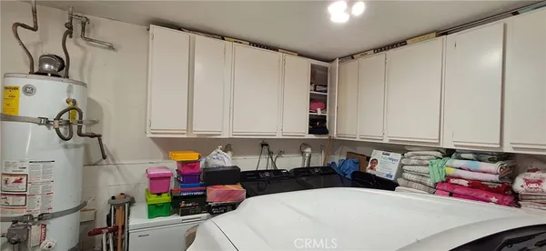 a kitchen with a refrigerator and cabinets