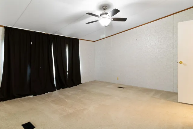 a bathroom with a sink double vanity mirror and a bathtub