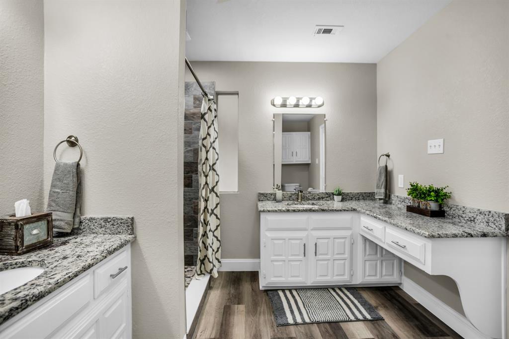5902 Fawn Valley Lane Rowlett, TX 75089 - Photo 21 of 27 a kitchen with a sink stove and cabinets