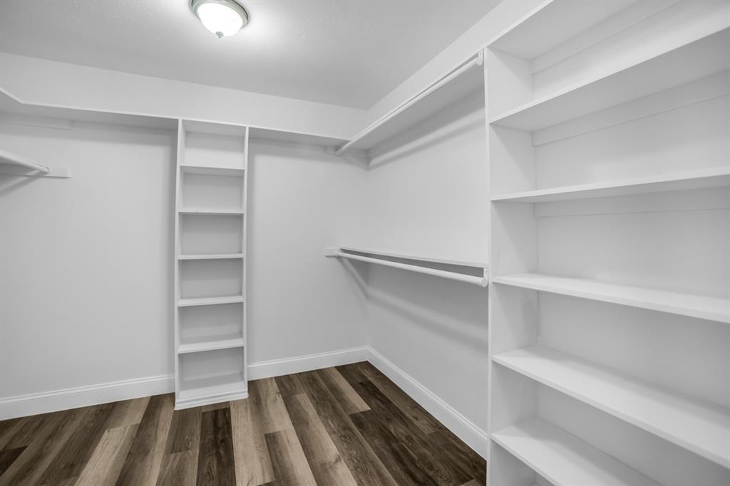 5902 Fawn Valley Lane Rowlett, TX 75089 - Photo 24 of 27 a view of walk in closet with empty racks