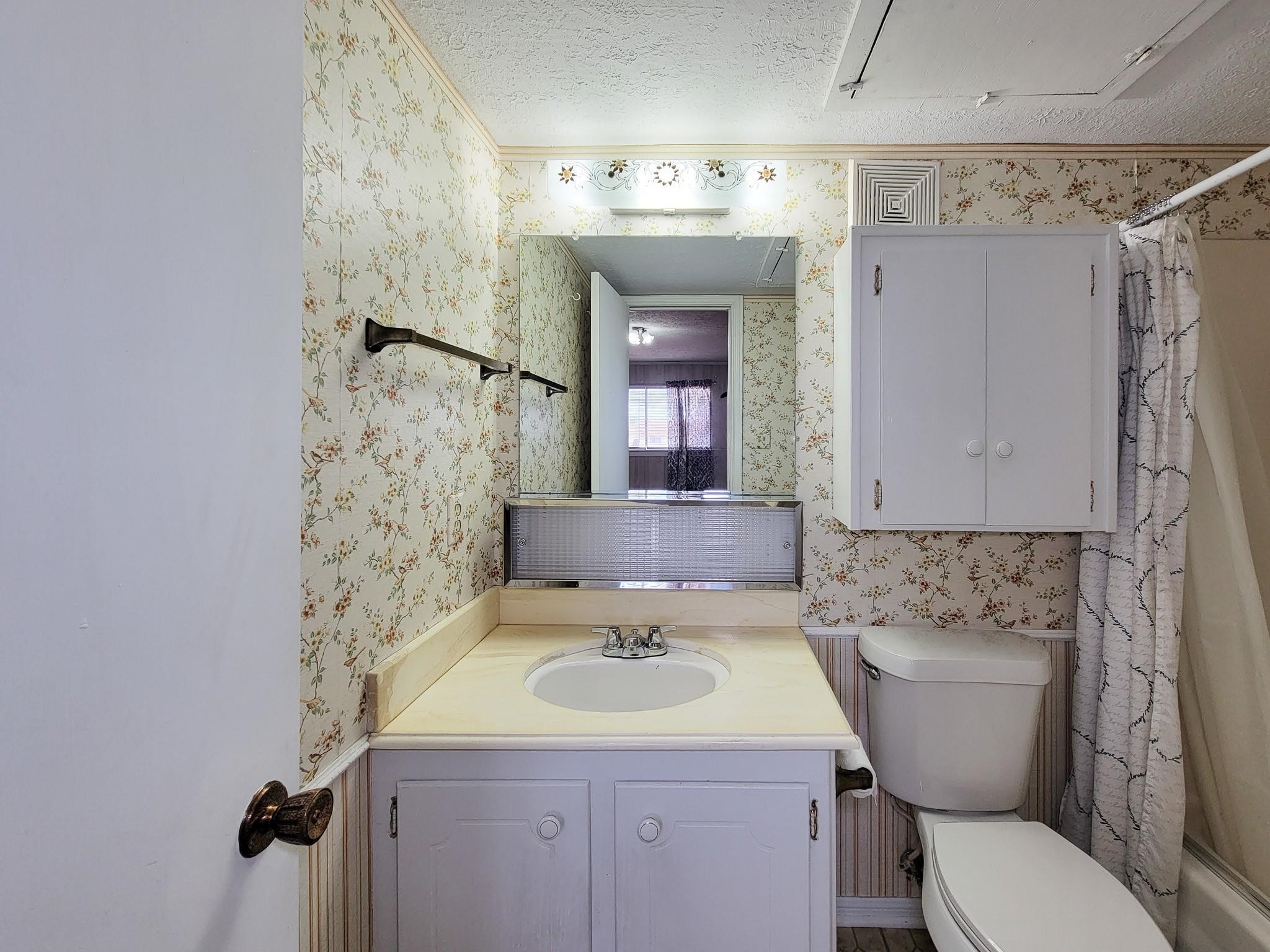 1815 Country Village Boulevard Humble, TX 77338 - Photo 13 of 34 a bathroom with a sink toilet and shower
