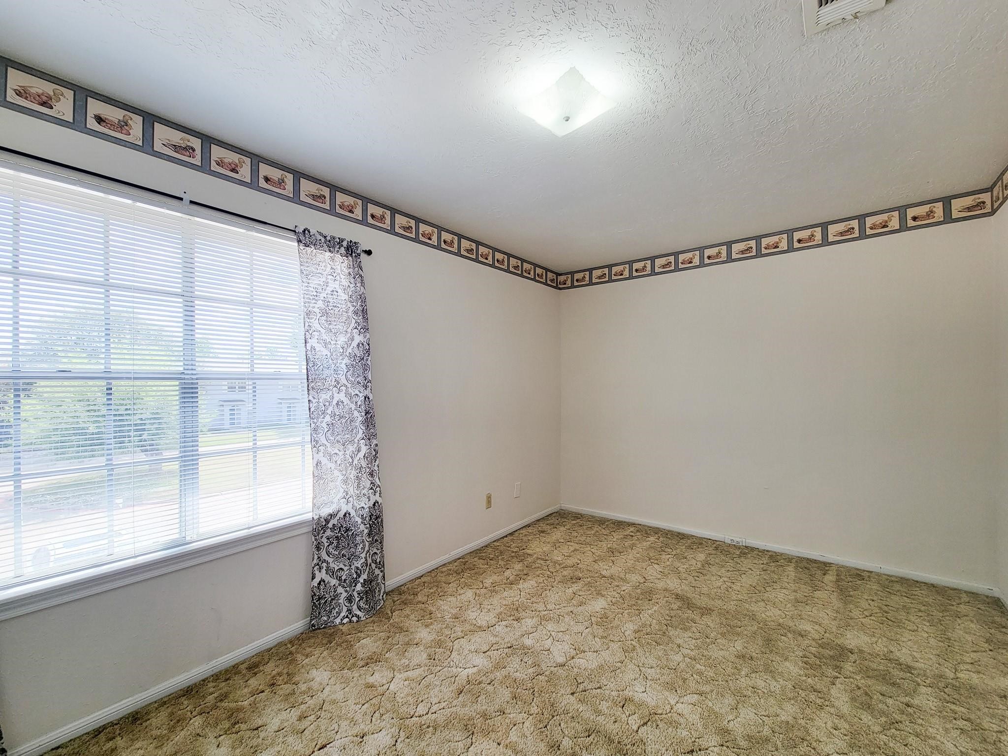 1815 Country Village Boulevard Humble, TX 77338 - Photo 3 of 34 a view of a room with window