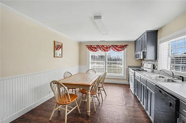a view of a dining room with furniture window and outside view