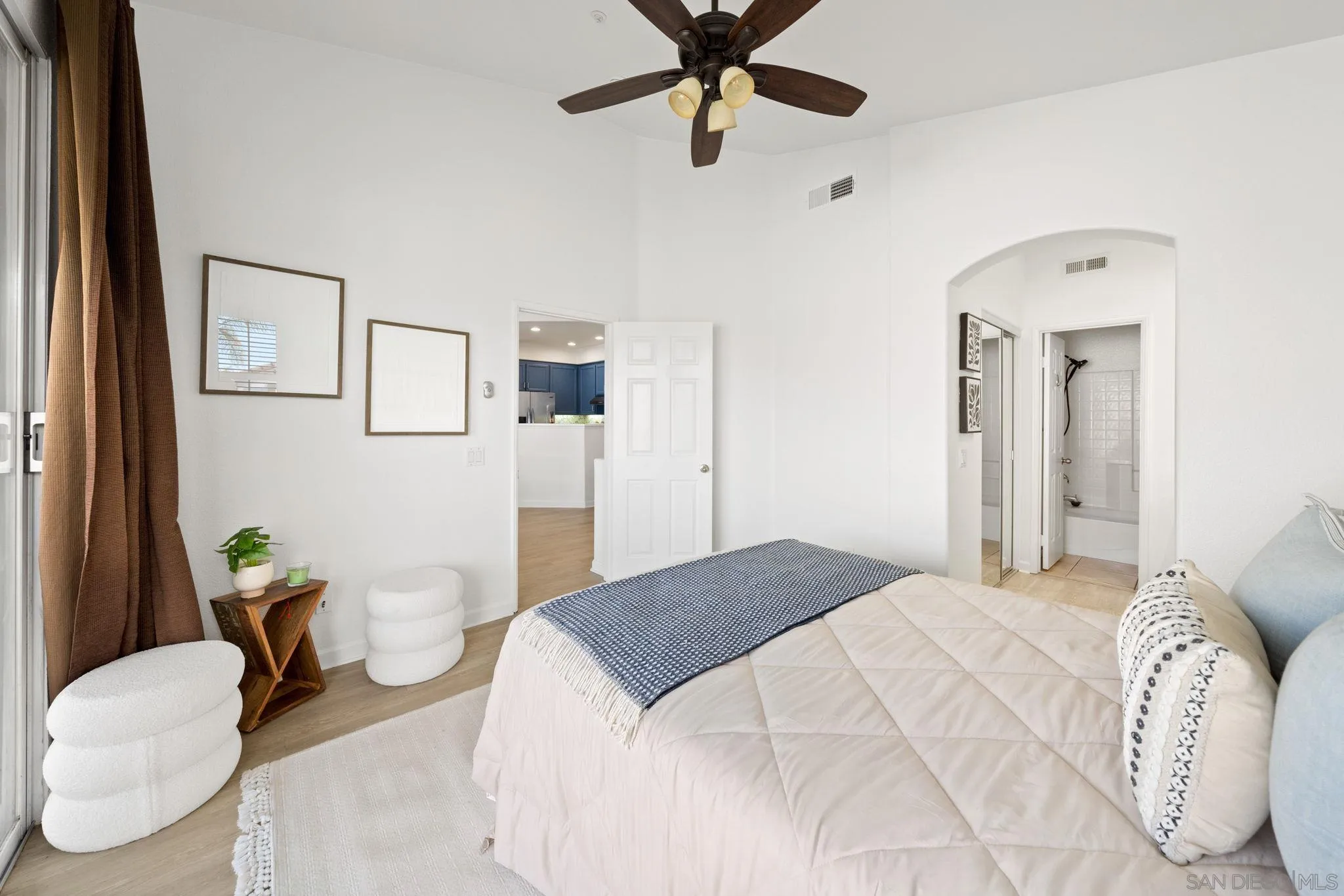 549 Sweet Pea Place Encinitas, CA 92024 - Photo 15 of 29 a bedroom with a bed couch and a window