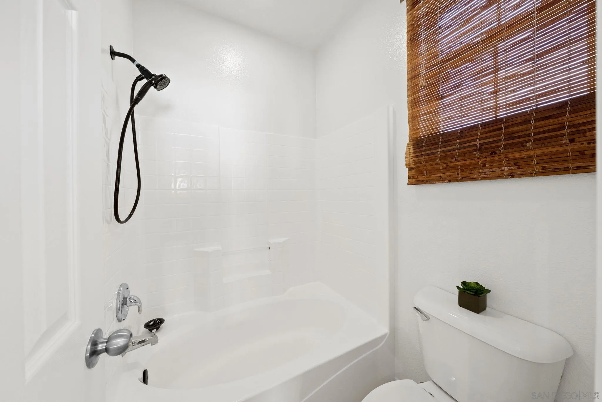 549 Sweet Pea Place Encinitas, CA 92024 - Photo 18 of 29 a bathroom with a shower a toilet and a shower