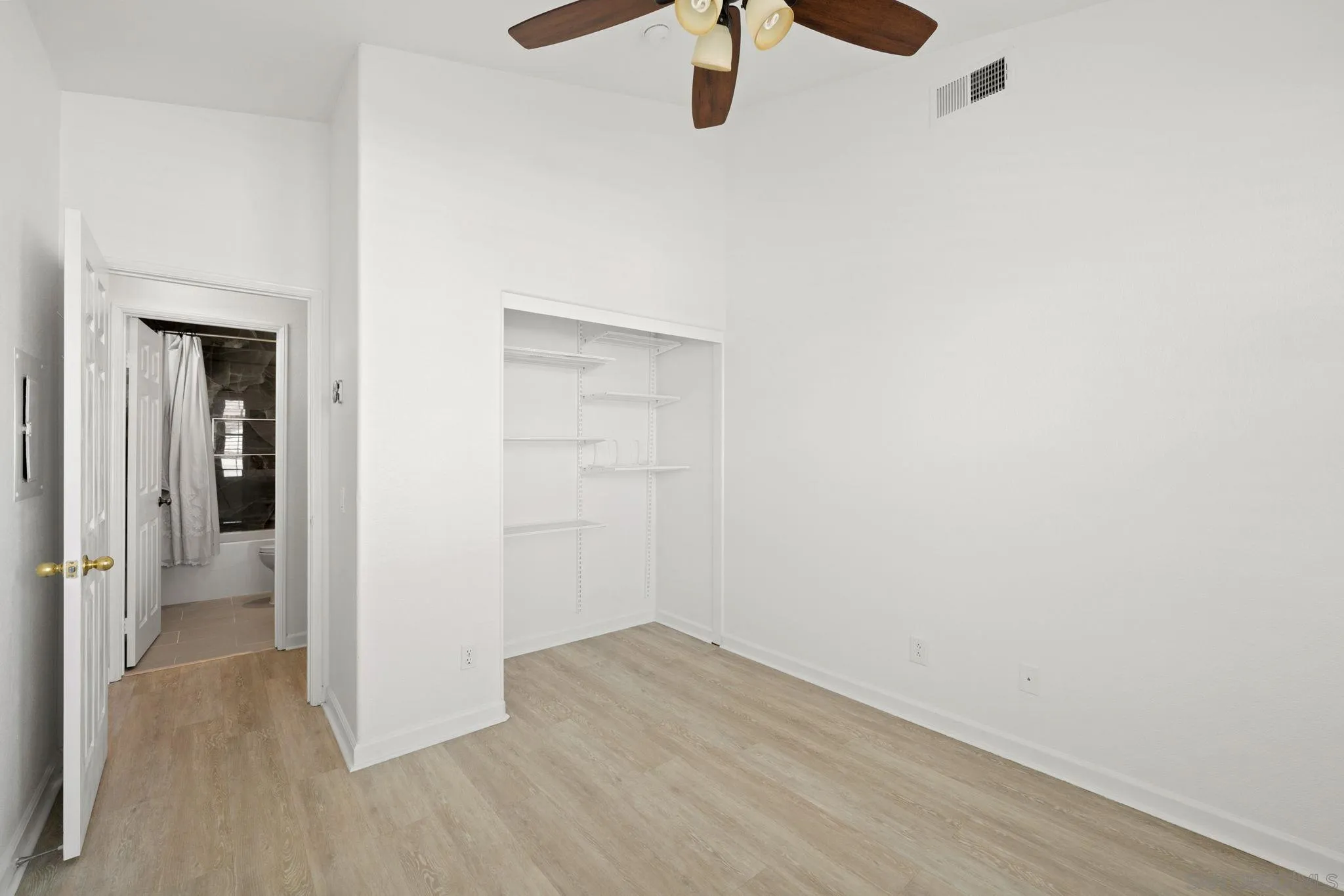 549 Sweet Pea Place Encinitas, CA 92024 - Photo 20 of 29 a view of a hallway with wooden floor