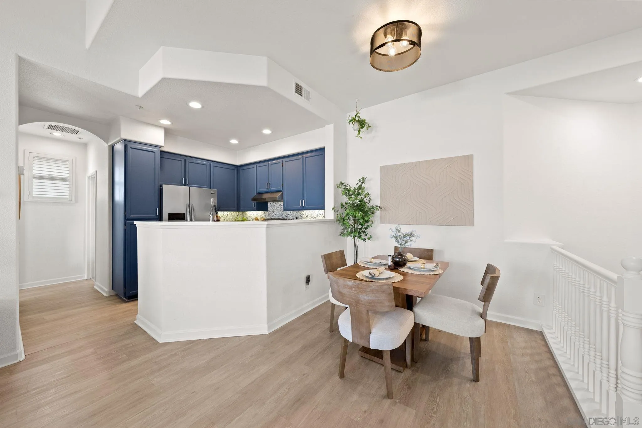 549 Sweet Pea Place Encinitas, CA 92024 - Photo 4 of 29 a dining room with furniture and a table