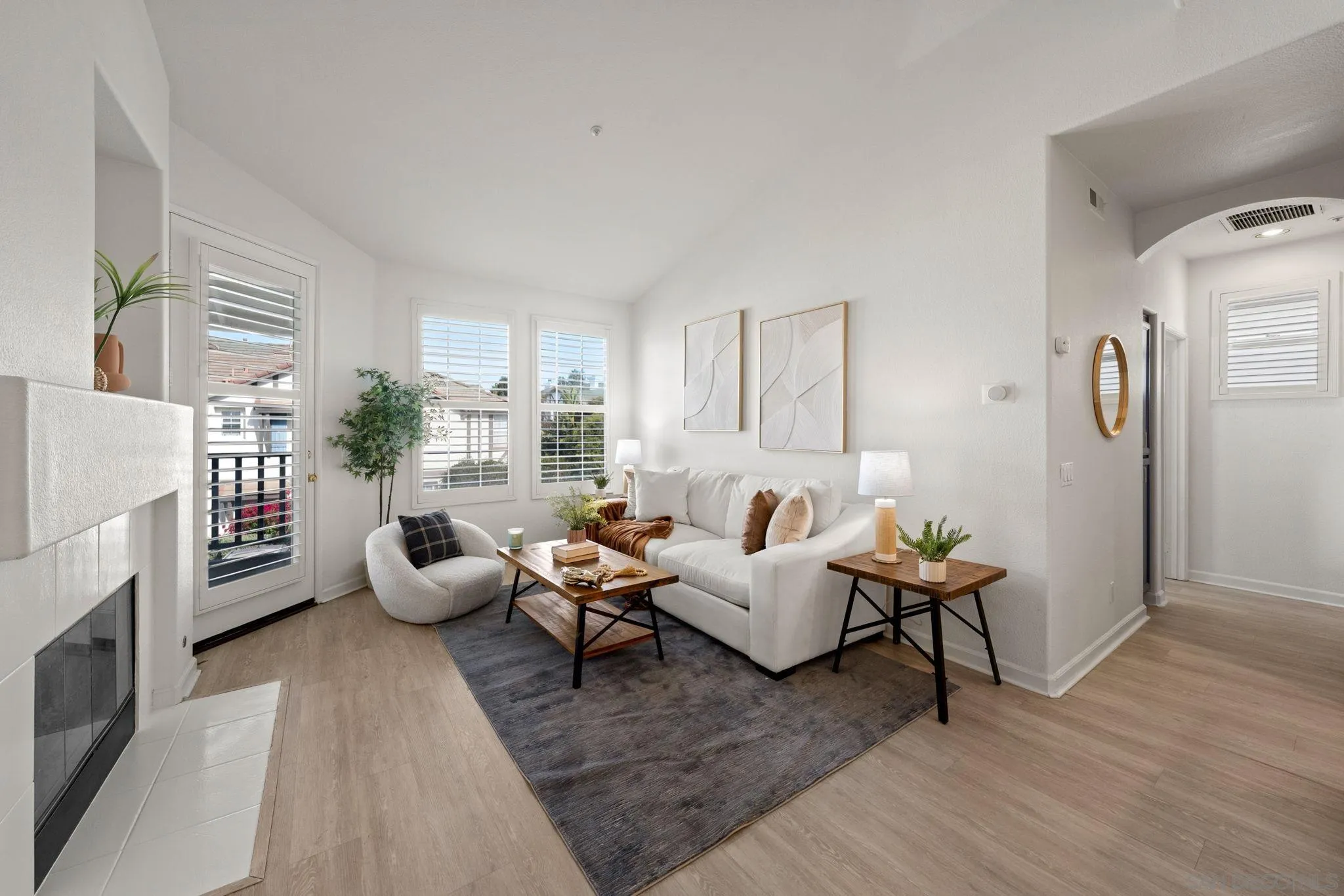 549 Sweet Pea Place Encinitas, CA 92024 - Photo 7 of 29 a living room with furniture fireplace and a large window