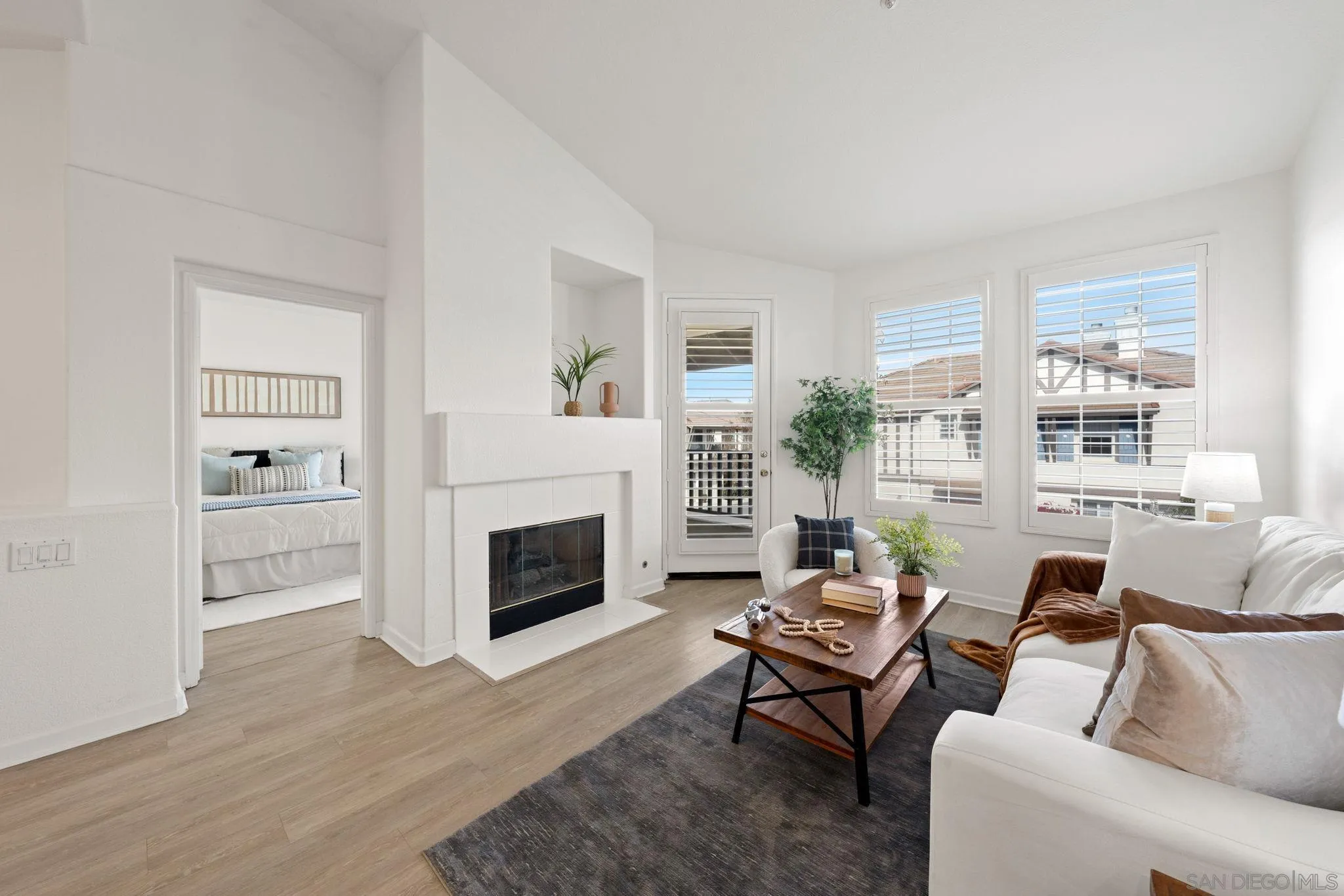 549 Sweet Pea Place Encinitas, CA 92024 - Photo 8 of 29 a living room with furniture and a fireplace