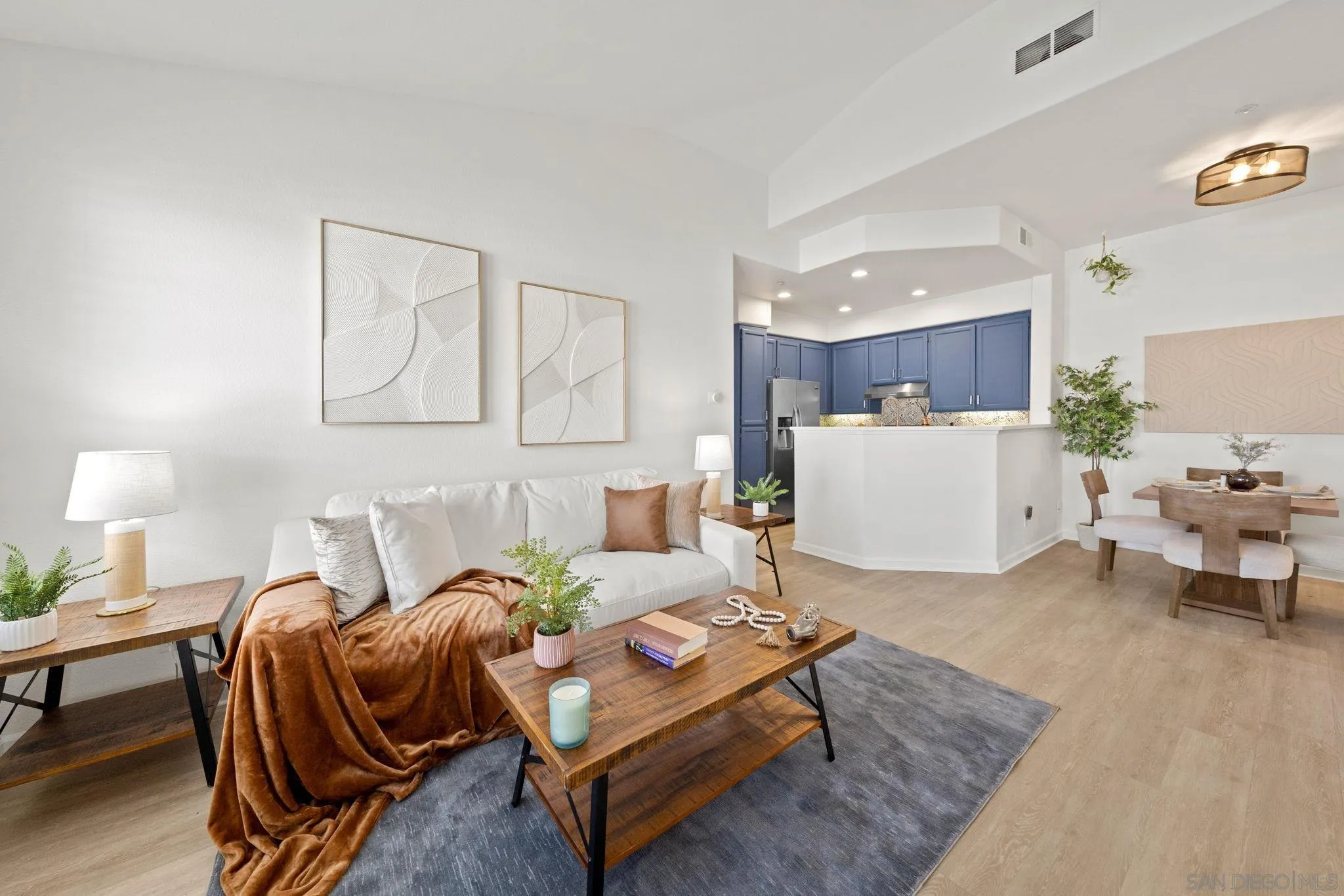 549 Sweet Pea Place Encinitas, CA 92024 - Photo 9 of 29 a living room with furniture and kitchen view