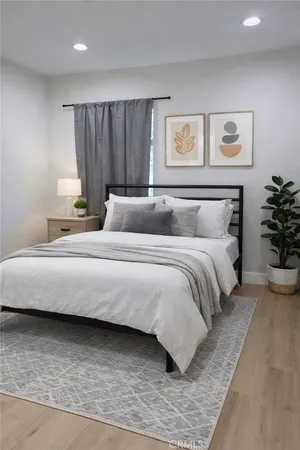 a bedroom with a large bed and a couch