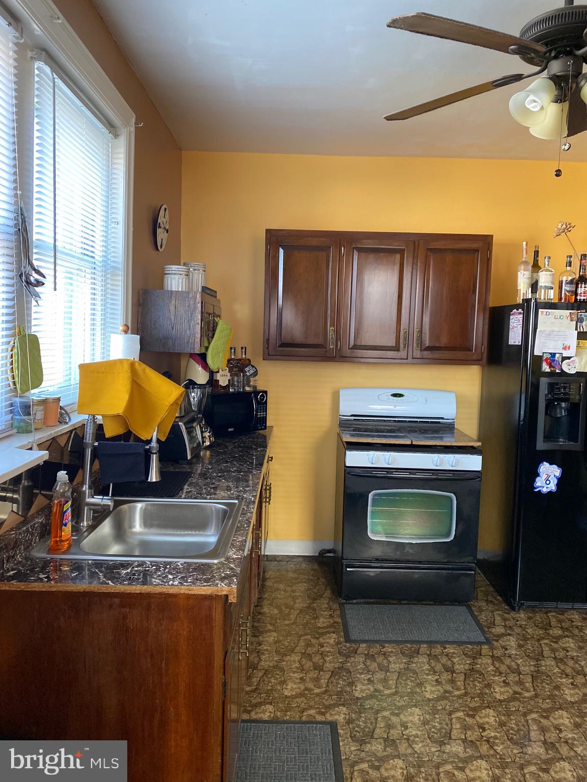 813 Levick Street Philadelphia, PA 19111 - Photo 17 of 43 a kitchen with stainless steel appliances granite countertop a stove a sink and a microwave