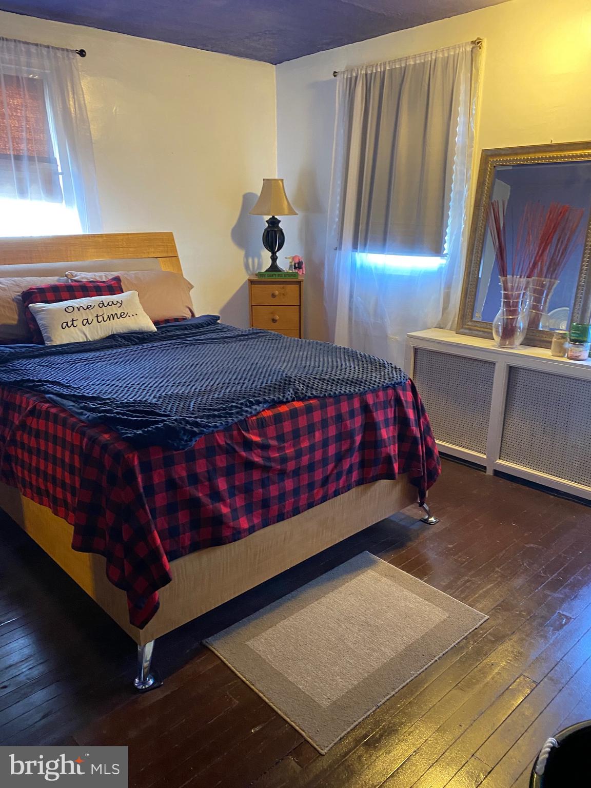 813 Levick Street Philadelphia, PA 19111 - Photo 30 of 43 a bed sitting in a bedroom next to a window