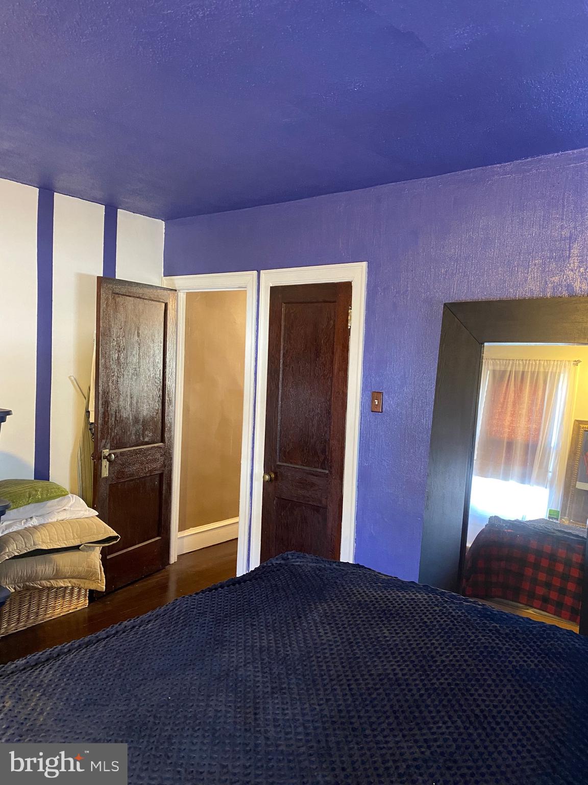813 Levick Street Philadelphia, PA 19111 - Photo 35 of 43 a bedroom with a bed and wooden floor