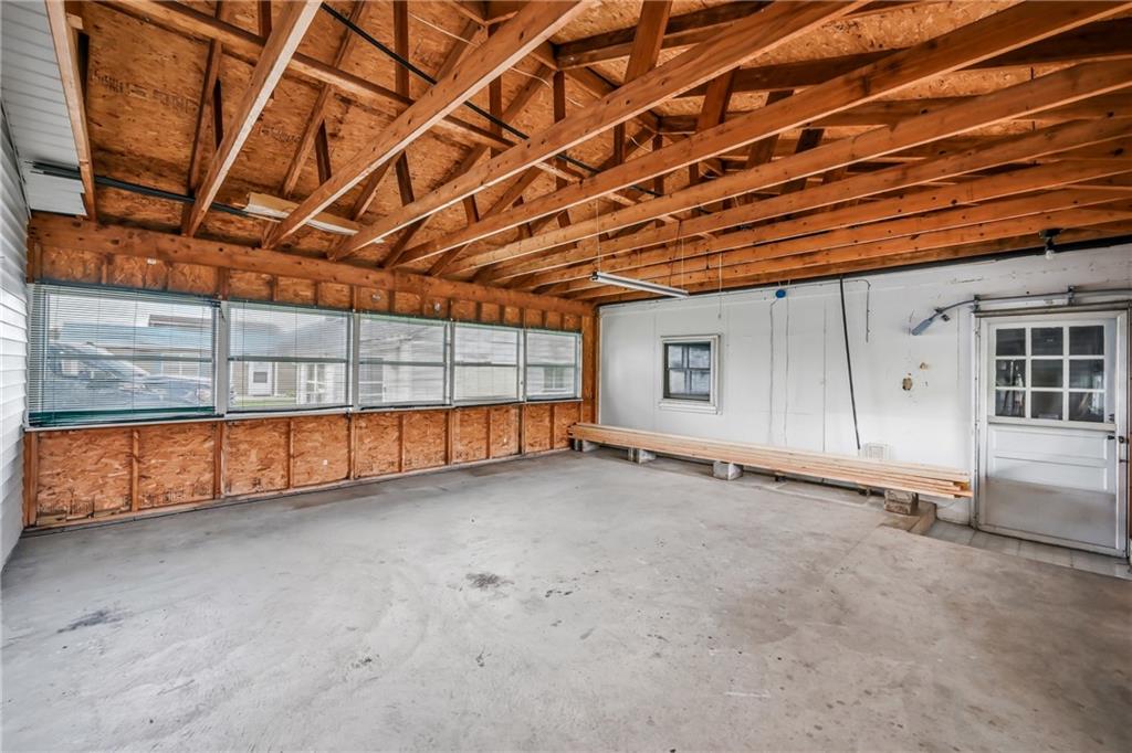 1919 West Washington Street New Castle, PA 16101 - Photo 21 of 30 Expansive "breezeway" / hobby room / gym / workshop/ storage- OR finish for more living space!