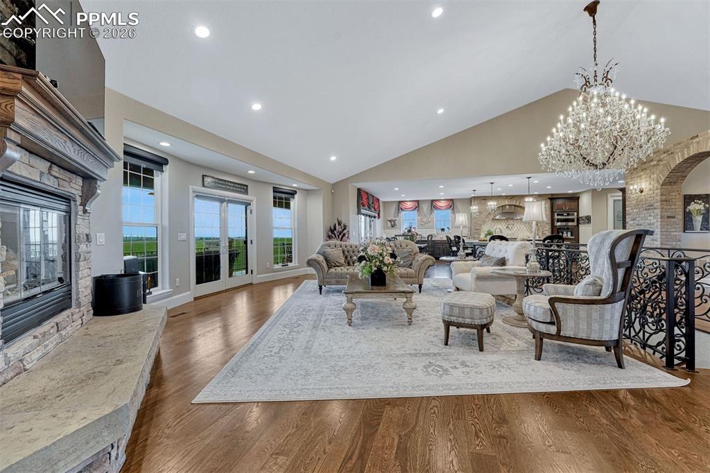 25995 Cave Spg Trail Elbert, CO 80106 - Photo 11 of 50 a view of a dining room with furniture wooden floor and chandelier