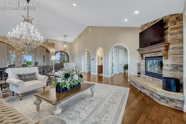 a living room with fireplace furniture and a flat screen tv