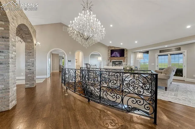 a view of a livingroom with furniture window and wooden floor
