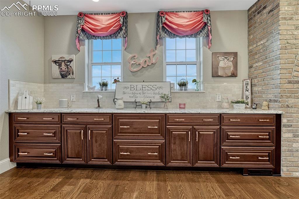 25995 Cave Spg Trail Elbert, CO 80106 - Photo 18 of 50 a bathroom with a granite countertop double vanity sink and a mirror