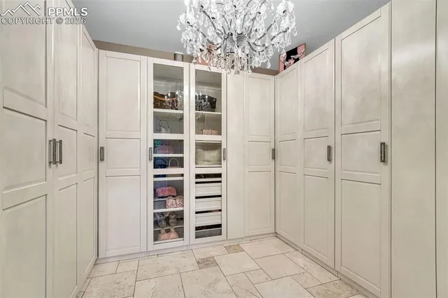 a view of a livingroom with an empty space and a window
