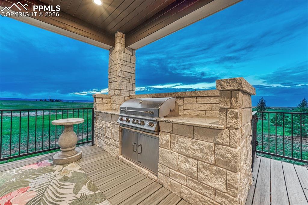 25995 Cave Spg Trail Elbert, CO 80106 - Photo 27 of 50 a view of a fireplace with wooden floor