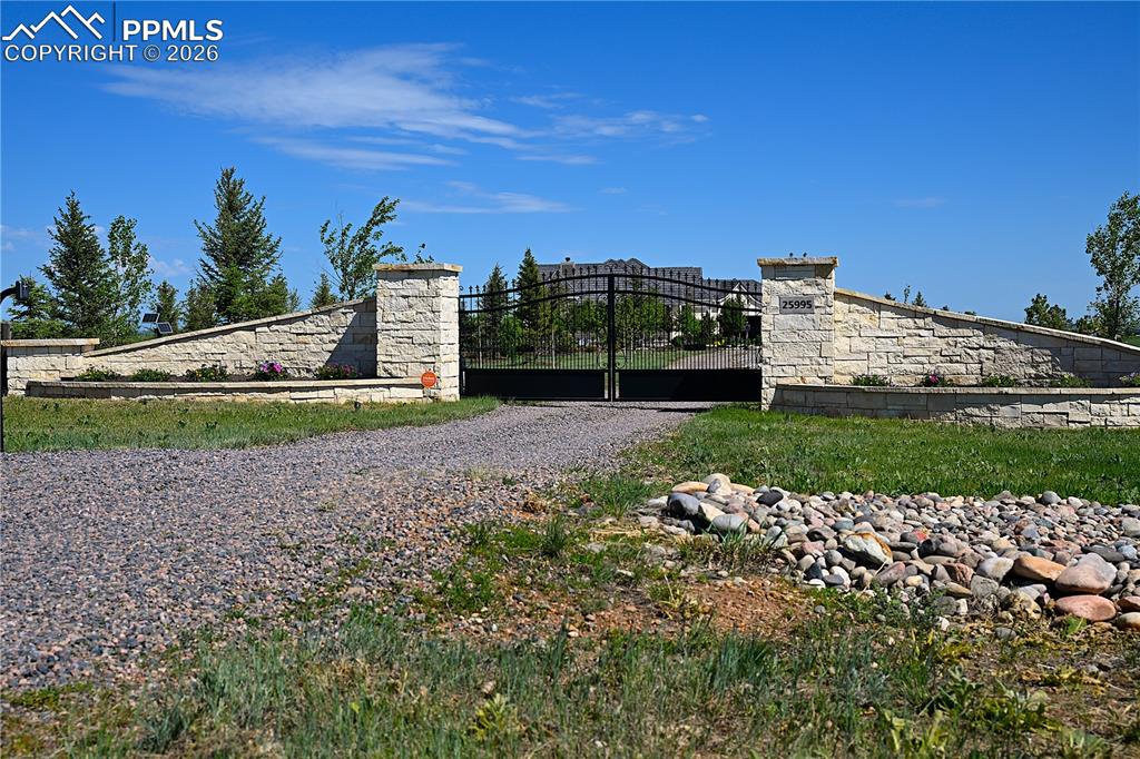 25995 Cave Spg Trail Elbert, CO 80106 - Photo 3 of 50 a view of a large building with a big yard