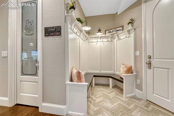 a view of a room with shelves and entryway