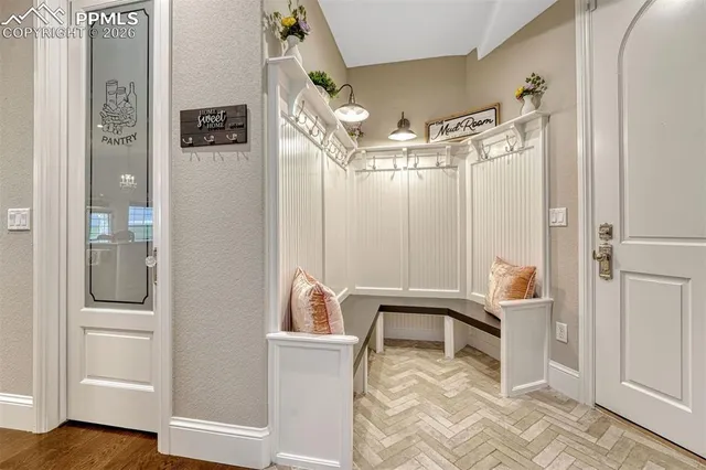 a view of a room with shelves and entryway