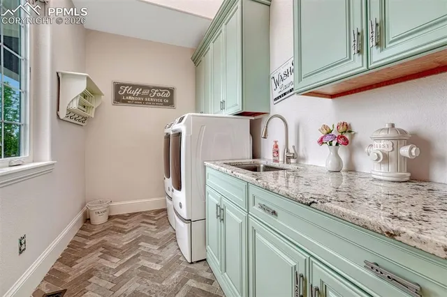 a bathroom with a sink and a washing machine