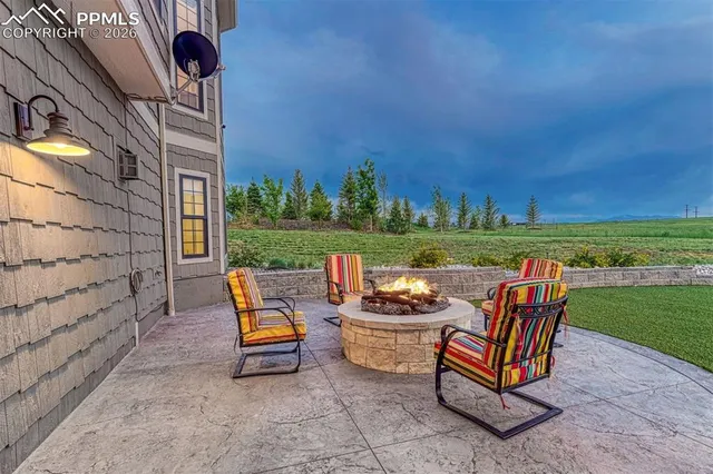 a backyard of a house with outdoor seating