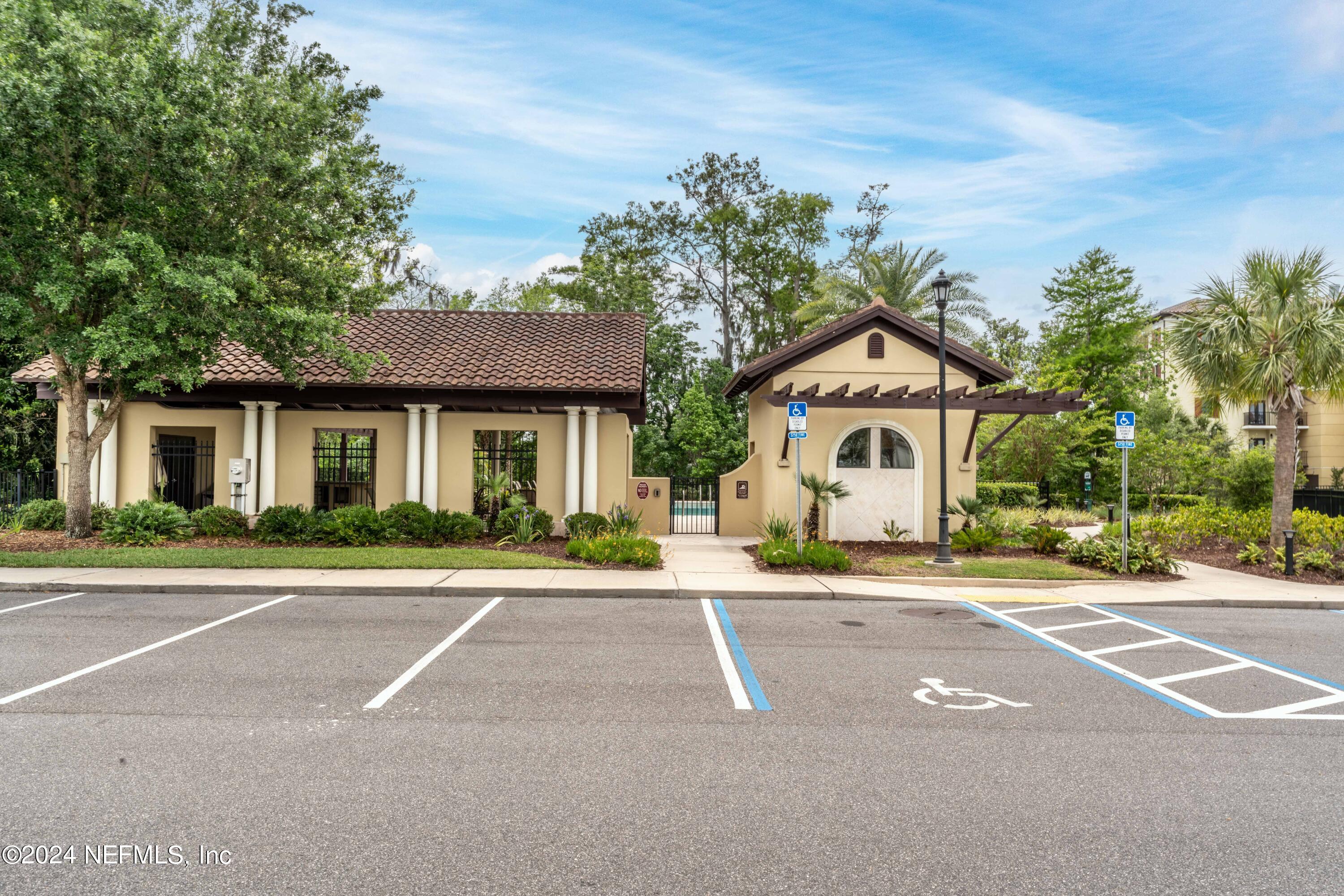 3958 Baymeadows Road, Unit 2203 Jacksonville, FL 32217 - Photo 53 of 85 a front view of a house with a yard