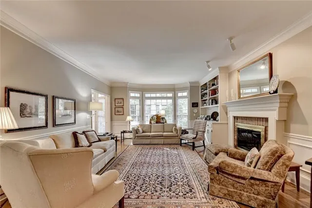 a living room with furniture fireplace and window
