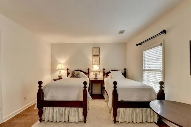 a bedroom with two beds and a couch