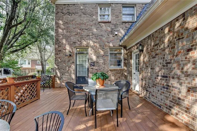 front view of a house with a tree