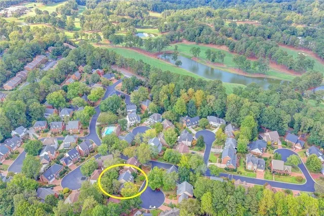 an aerial view of residential house with outdoor space and swimming pool
