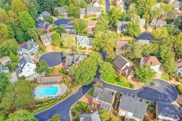an aerial view of a house with outdoor space