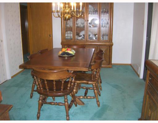Dining Room. The large dining room was originally the third bedroom, and there are hardwood floors under the carpeting.