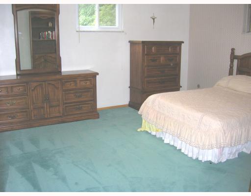 Other. Large master bedroom with good closet space and hardwood floors under the carpeting.