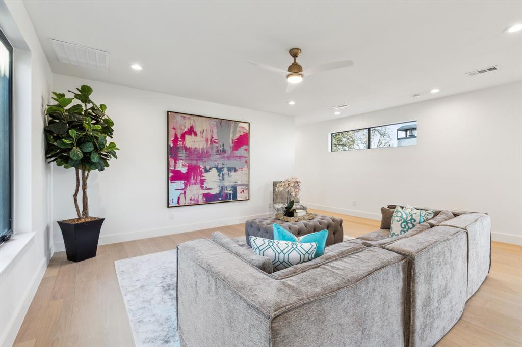 4311 Merrell Road Dallas, TX 75229 - Photo 22 of 30 a living room with furniture and a potted plant