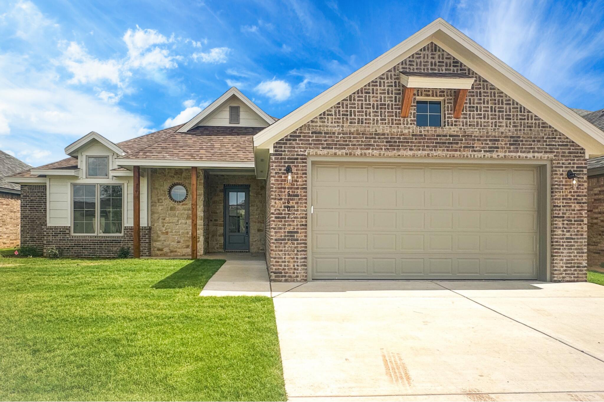 5607 119th Street Lubbock, TX 79424 - Photo 1 of 33 a front view of a house with a yard
