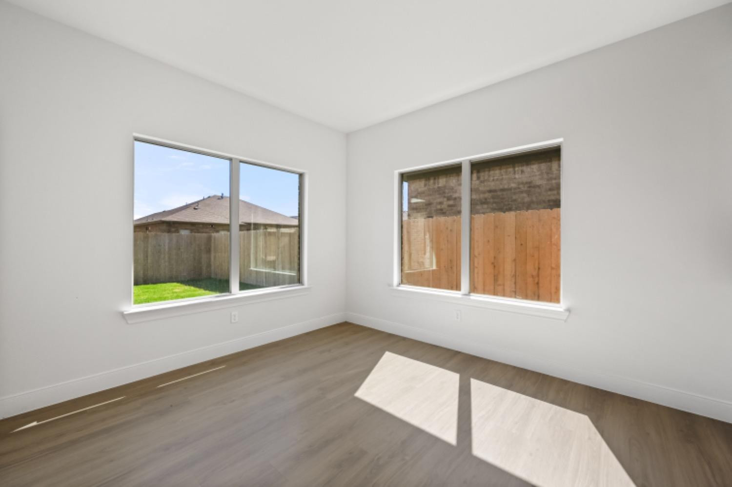 5607 119th Street Lubbock, TX 79424 - Photo 14 of 33 an empty room with windows